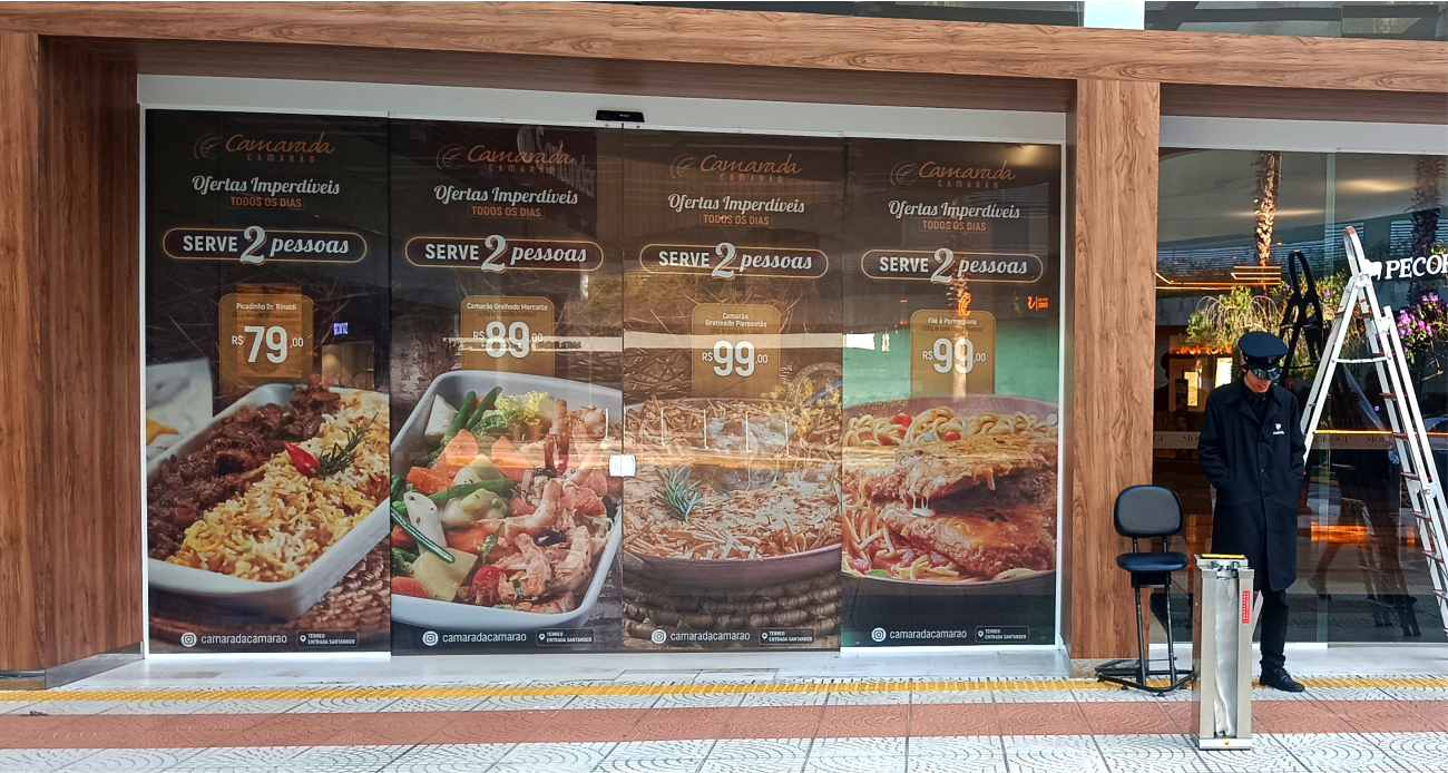 realcom_servicos_adesivacao_vidro_perfurado_campanha_shopping