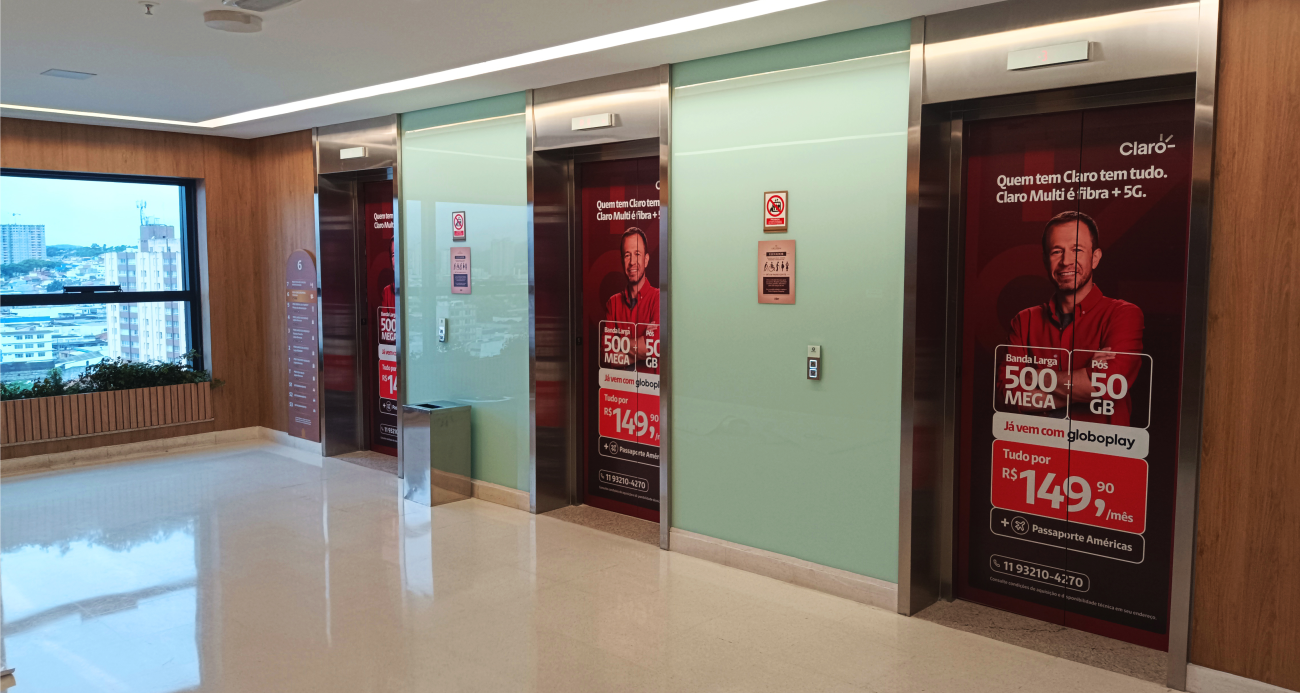 realcom_servicos_adesivacao_elevador_claro_shopping